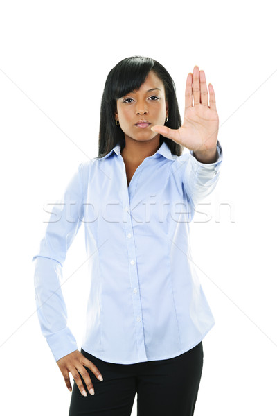 Serious young woman giving stop gesture Stock photo © elenaphoto