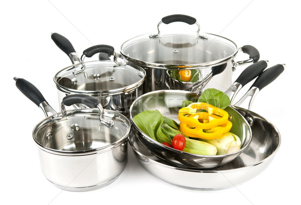 Stock photo: Stainless steel pots and pans with vegetables