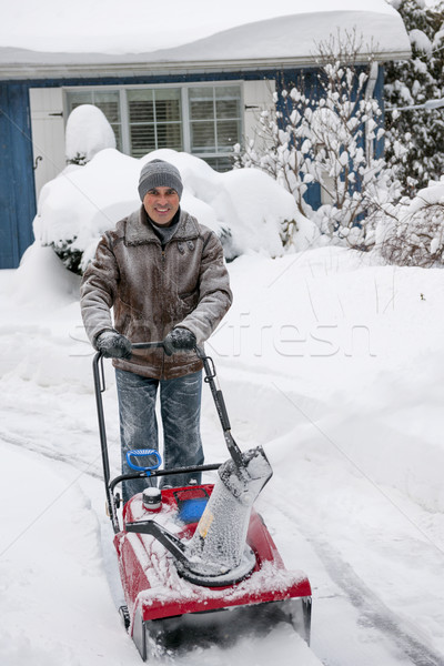 Mann Auffahrt tief Schnee Wohn- Haus Stock foto © elenaphoto