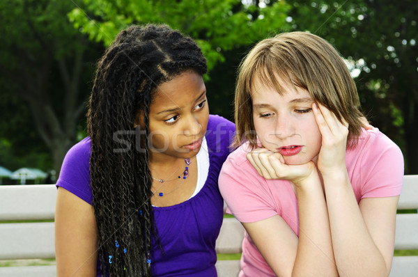 Teenager consoling her friend Stock photo © elenaphoto