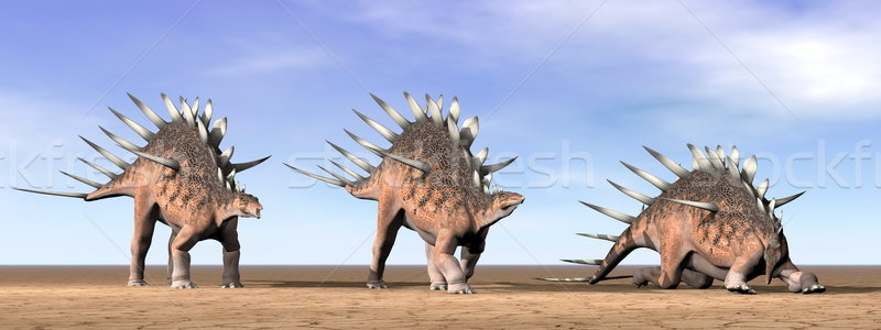 Stock photo: Kentrosaurus dinosaurs in the desert - 3D render