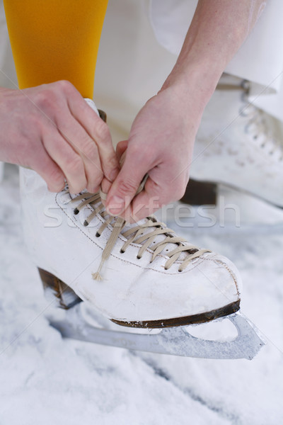 Putting on ice skates. Stock photo © ElinaManninen