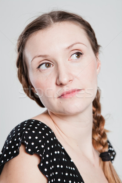 Portrait of attractive woman looking to side Stock photo © ElinaManninen