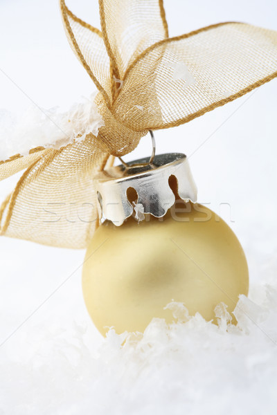 Gold Christmas bauble decoration with ribbon. Stock photo © ElinaManninen