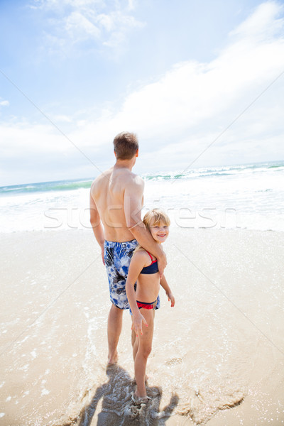 Father and happy young daughter at beach Stock photo © ElinaManninen