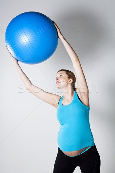 Pregnant woman exercising with fitness ball Stock photo © ElinaManninen