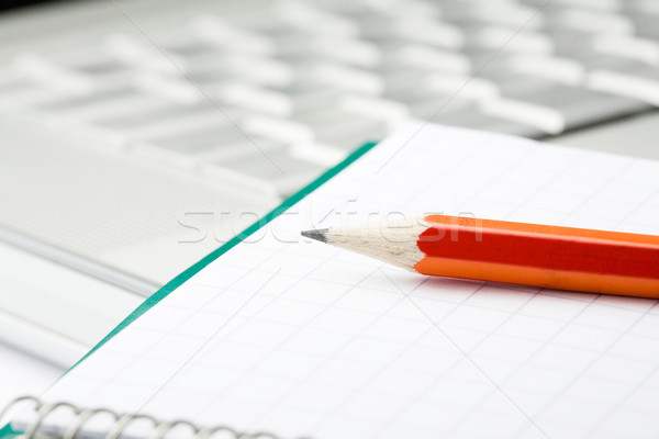 Pencil, notepad and laptop. Stock photo © ElinaManninen