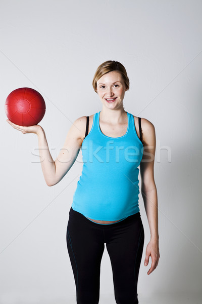 Pregnant woman exercising with exercise ball Stock photo © ElinaManninen
