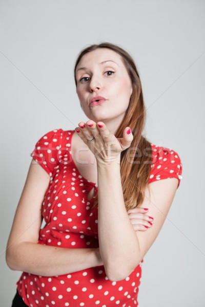 Stock photo: Attractive woman blowing kiss