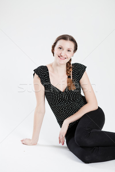 Happy attractive woman sitting Stock photo © ElinaManninen