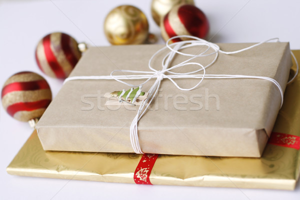 Two simply wrapped Christmas gifts with decorations. Stock photo © ElinaManninen