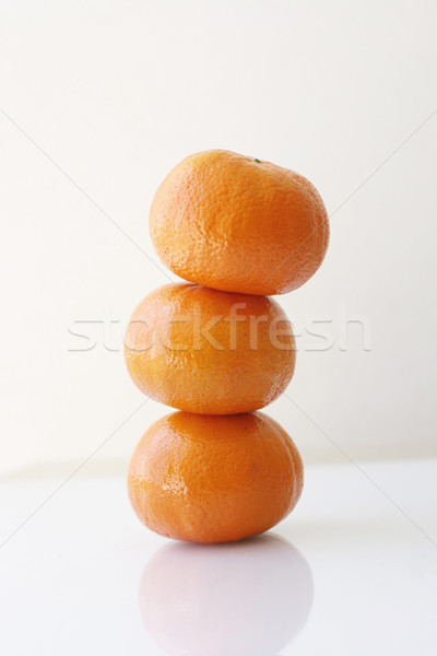 Stack of mandarins. Stock photo © ElinaManninen