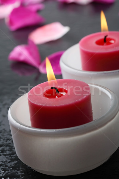Candle and flower petal decoration. Stock photo © ElinaManninen