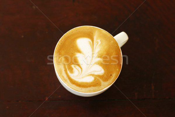 Top view of piccolo latte with a coffee art design. Stock photo © ElinaManninen