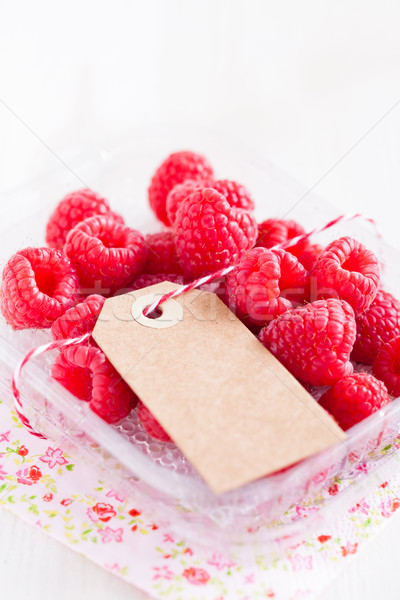 Stock photo: Fresh raspberries and cardboard tag