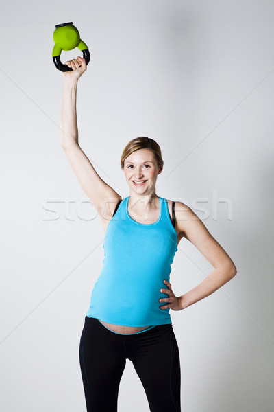 Stok fotoğraf: Hamile · kadın · egzersiz · kettlebells · omuz · kas · egzersiz