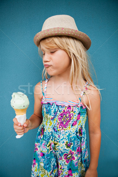 Stock photo: Young girl holding ice cream cone