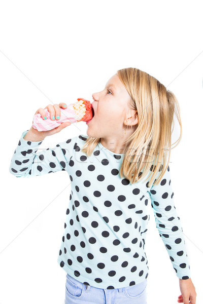 Girl eating strawberry ice cream Stock photo © ElinaManninen