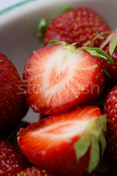 Fresh strawberries in a bowl. Stock photo © ElinaManninen