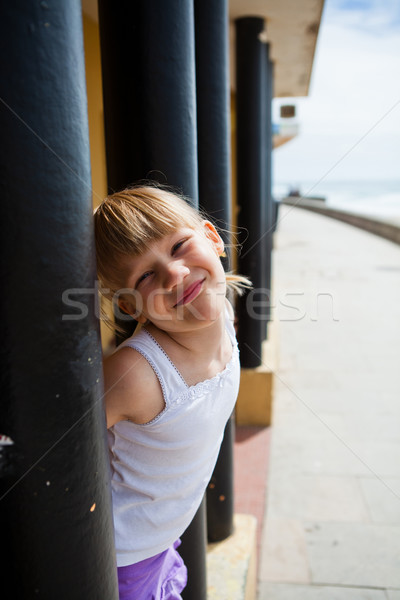 Young girl on beachside walkway Stock photo © ElinaManninen