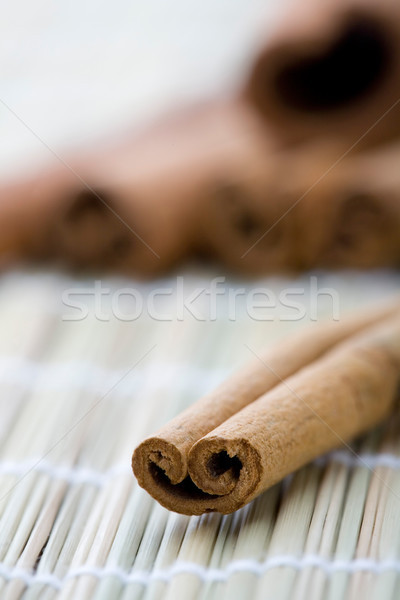 Cinnamon stick on table mat. Stock photo © ElinaManninen