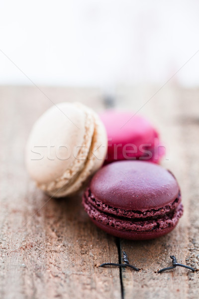 Macaroons on wooden table Stock photo © ElinaManninen