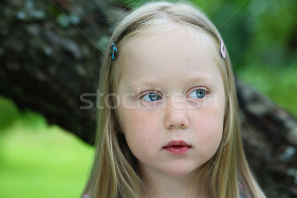 Portrait of thoughtful little girl. Stock photo © ElinaManninen