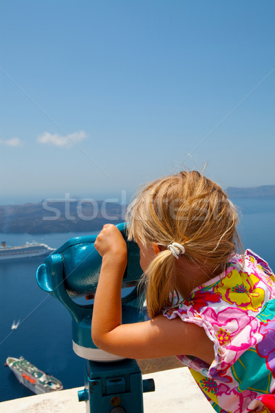 Girl looking with binoculars in Thira, Santorini, Greece Stock photo © ElinaManninen