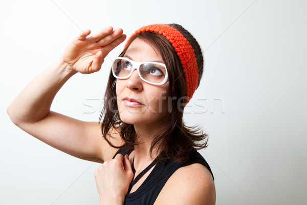 Young trendy woman saluting Stock photo © ElinaManninen