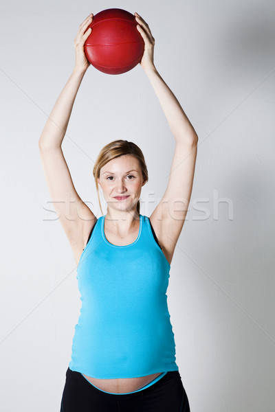 Pregnant woman exercising with ball Stock photo © ElinaManninen