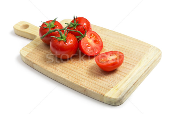 Fresh tomatoes on wooden chopping board   Stock photo © Elisanth