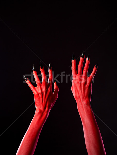 Czerwony diabeł ręce czarny paznokcie Zdjęcia stock © Elisanth