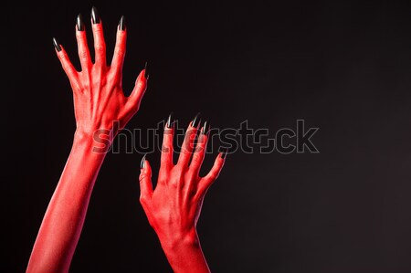 Piros ördög kezek mutat nehézfém kézmozdulat Stock fotó © Elisanth