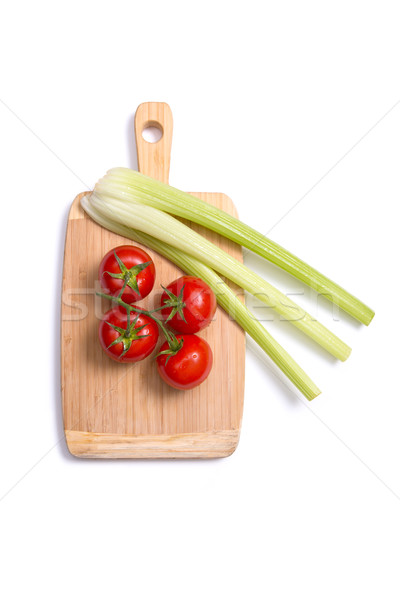 Fresh tomatoes and celery sticks on chopping board  Stock photo © Elisanth