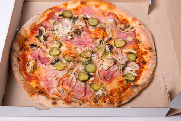 Close-up shot of tasty Italian pizza with ham, and onion  Stock photo © Elisanth