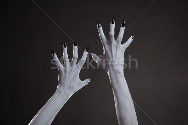 Démoni kezek fekete körmök halloween testművészet Stock fotó © Elisanth