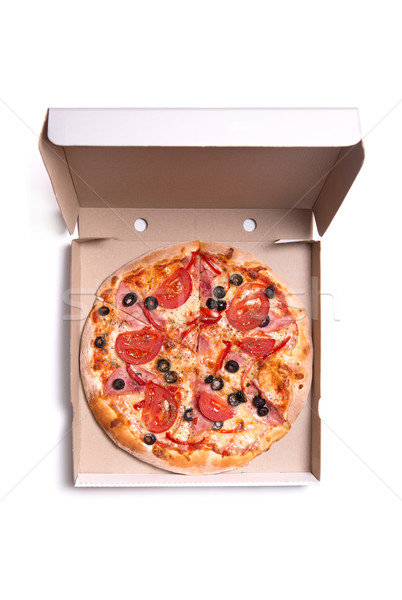 Tasty pizza with ham and tomatoes in box  Stock photo © Elisanth