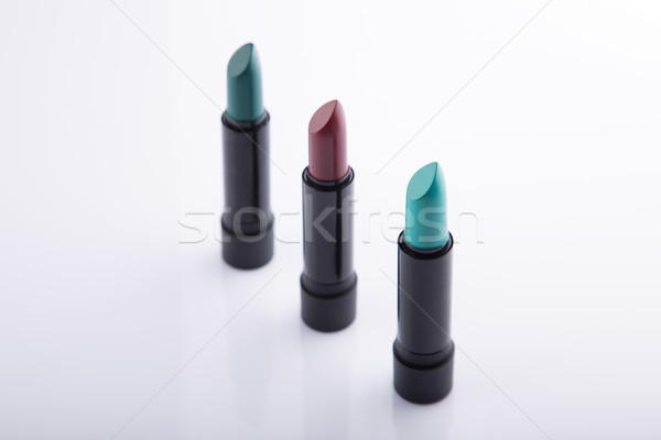 Row of three lipsticks in bold colors  Stock photo © Elisanth
