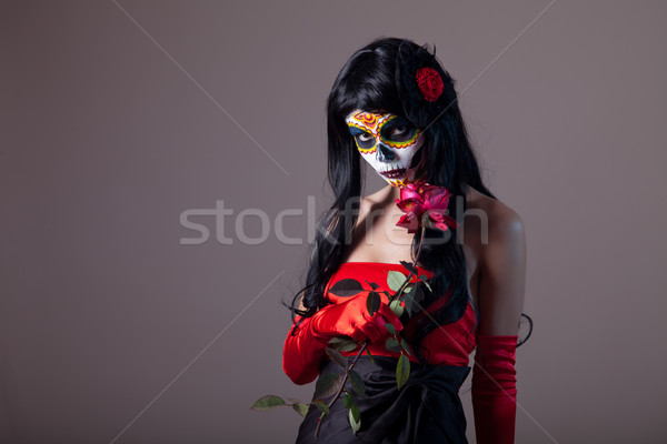 Sugar skull girl holding red rose  Stock photo © Elisanth