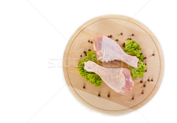 Stock photo: Fresh raw chicken legs with green salad 