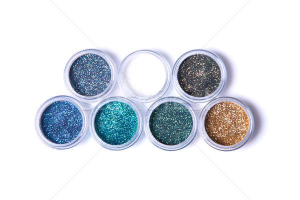 Two rows of metallic glitters in jars   Stock photo © Elisanth