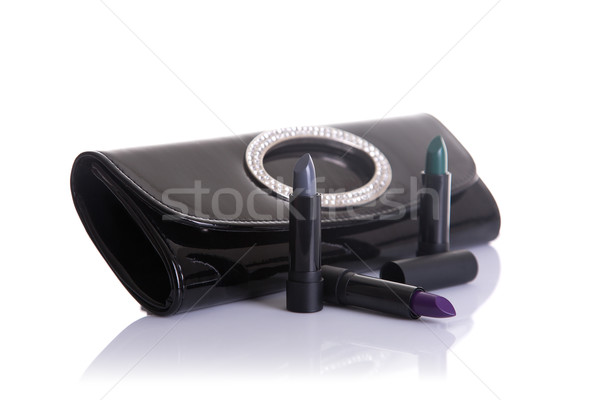 Black handbag clutch and lipsticks in green, gray and purple col Stock photo © Elisanth