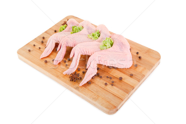 Raw chicken wings on chopping board  Stock photo © Elisanth