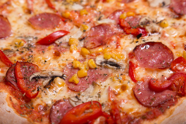 Close-up shot of delicious Italian pizza with pepperoni and mush Stock photo © Elisanth