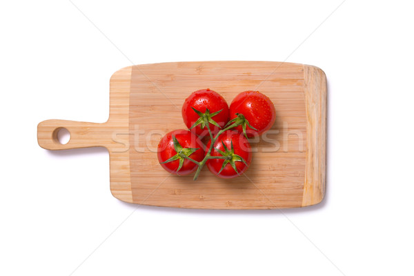 Top view of fresh juicy tomatoes on chopping board  Stock photo © Elisanth