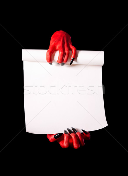 Red devil hands with black nails holding blank paper scroll Stock photo © Elisanth