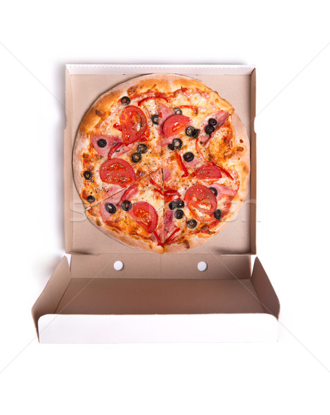 Delicious pizza with ham and tomatoes in box  Stock photo © Elisanth