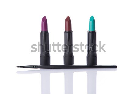 Beauty products, makeup brush and three lipsticks  Stock photo © Elisanth