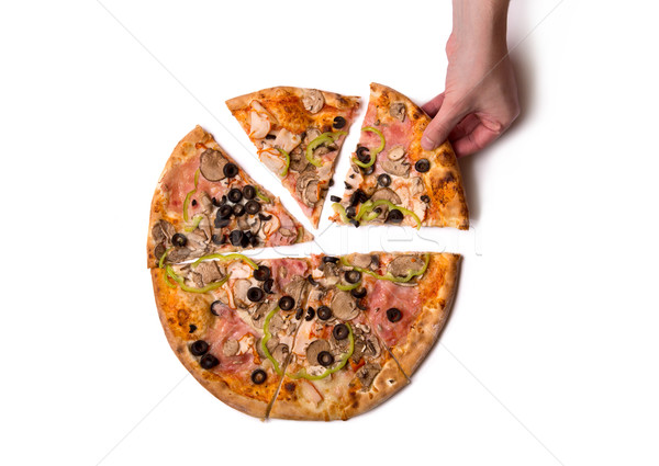 Top view of male hand picking delicious Italian pizza slice  Stock photo © Elisanth