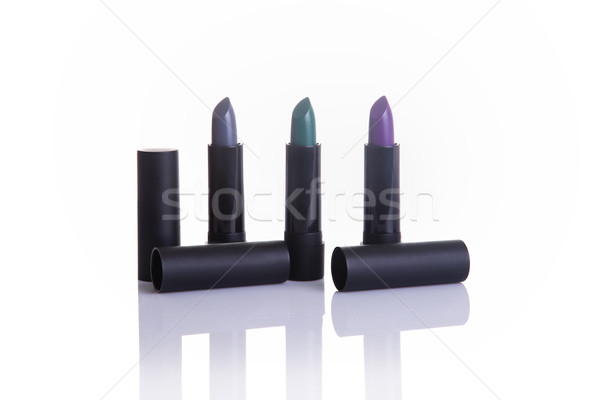 Lipsticks in gray, green and purple colors   Stock photo © Elisanth